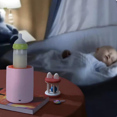 chauffe biberon sans fil rose sur la table