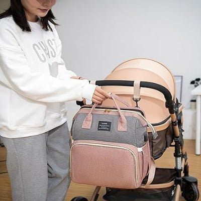 sac a dos a langer rose attache a poussette